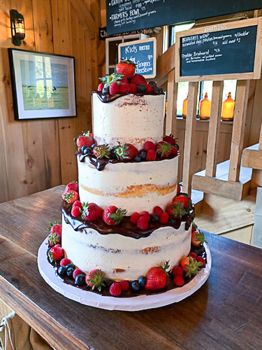 Rustic wedding cake with strawberries